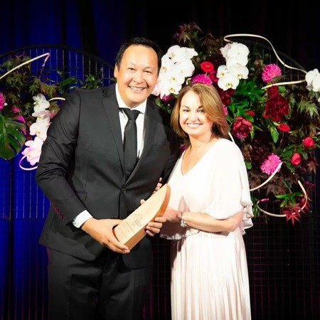 iFLY Queenstown Managing Director Matt Wong accepts Tourism Industry Aotearoa Community Engagement Award presented by Category Sponsor Kristin Dunne of Destination Wayfinder